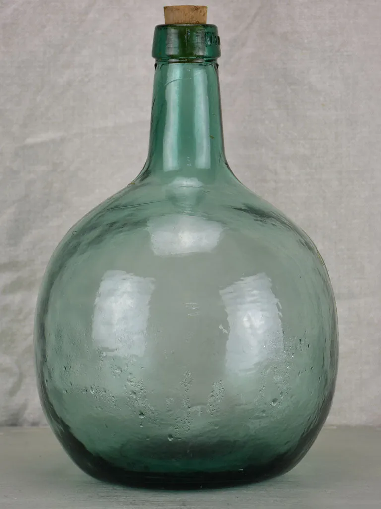 Small antique French demijohn bottle