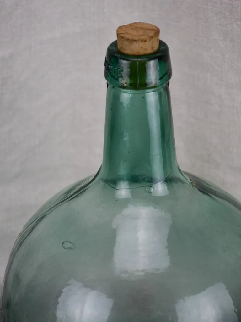 Small antique French demijohn bottle