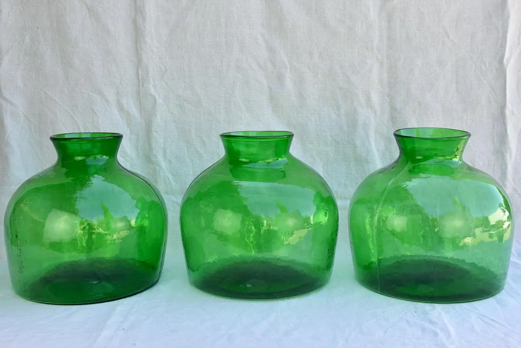 Three very large green glass vases / bottles 13½"