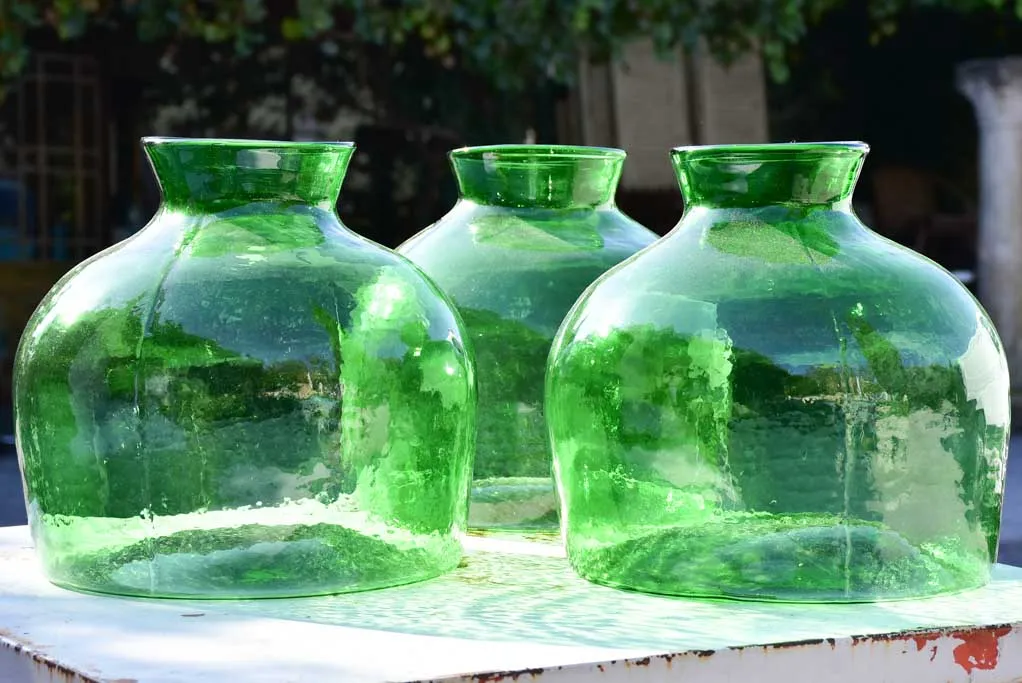 Three very large green glass vases / bottles 13½"