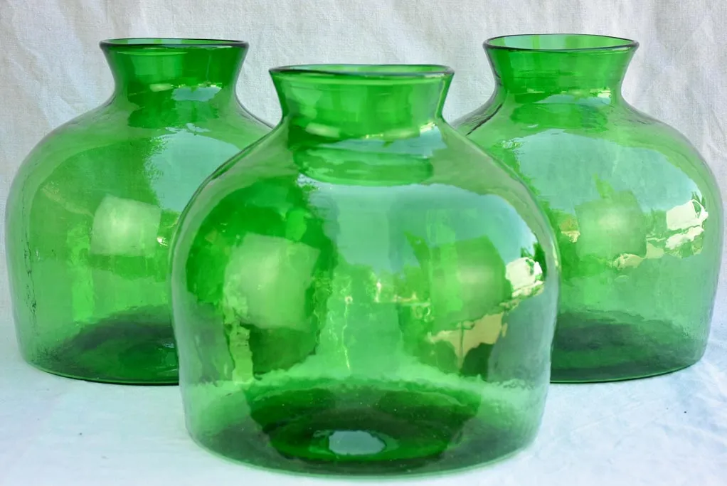 Three very large green glass vases / bottles 13½"